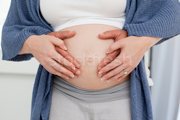 Couple's hand on the belly of the pregnant woman Stock photo © wavebreak_media