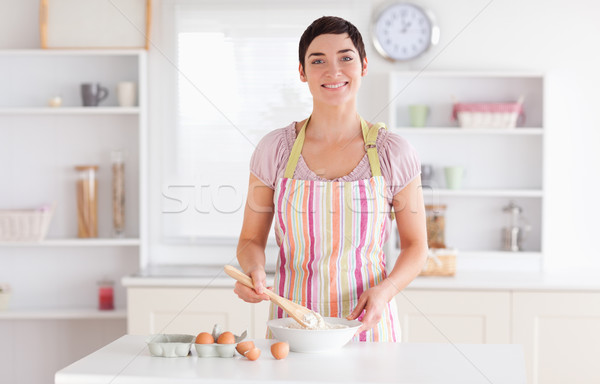 Short-haired brunette woman preparing a cake in a kitchen Stock photo © wavebreak_media