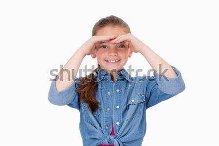 Smiling girl looking ahead against a white background Stock photo © wavebreak_media