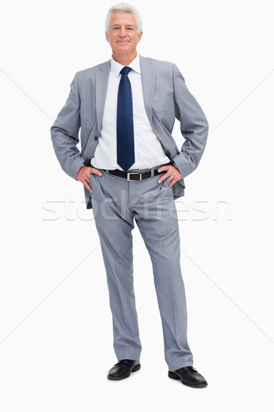 Portrait of a man in a suit with hands on hips against white babckground Stock photo © wavebreak_media