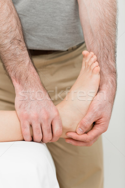 Foot being manipulated by a practitioner in a room Stock photo © wavebreak_media