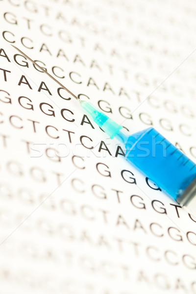 Stock photo: Syringe put on dna test writing in capital letters