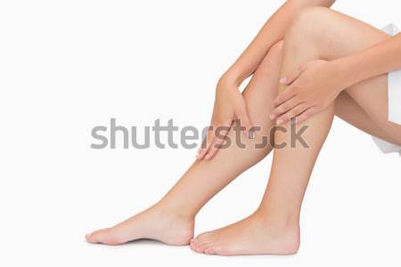 Nő ül mutat lábak megérint kéz Stock fotó © wavebreak_media