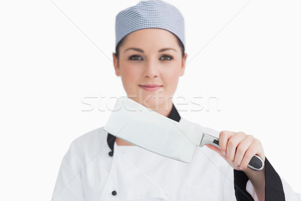 Smiling cook holding a meat cleaver in front of camera Stock photo © wavebreak_media