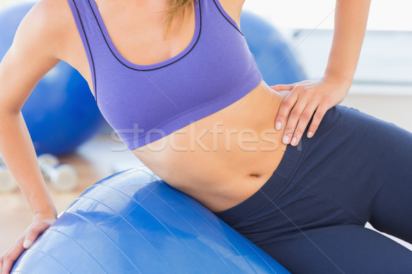 Mid section of a fit woman exercising with fitness ball Stock photo © wavebreak_media