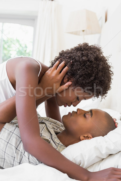 Intimate couple lying on their bed Stock photo © wavebreak_media