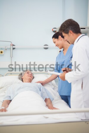 Pediatric dentist examining a patients teeth in the dentists cha Stock photo © wavebreak_media