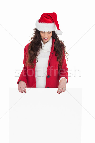 Festive brunette showing white poster Stock photo © wavebreak_media