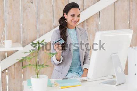 Stylish brunette working from home Stock photo © wavebreak_media