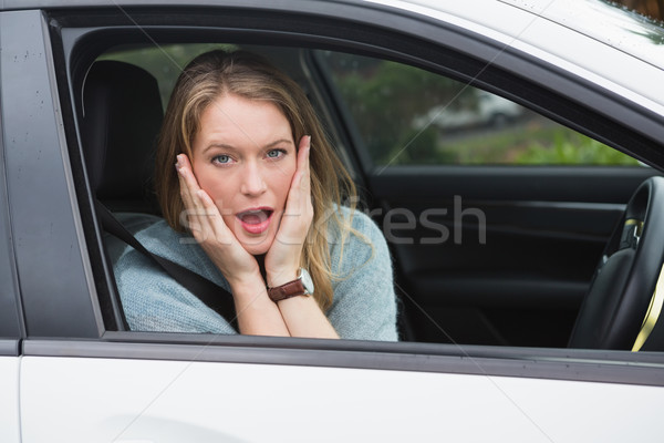 Shocked woman sitting in drivers seat Stock photo © wavebreak_media