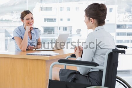 Smiling businesswoman interviewing disabled candidate Stock photo © wavebreak_media