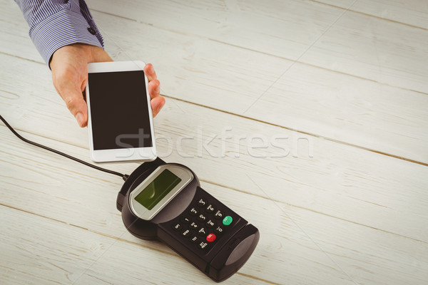 Man using smartphone to express pay  Stock photo © wavebreak_media