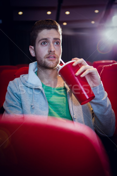 Young man watching a film  Stock photo © wavebreak_media