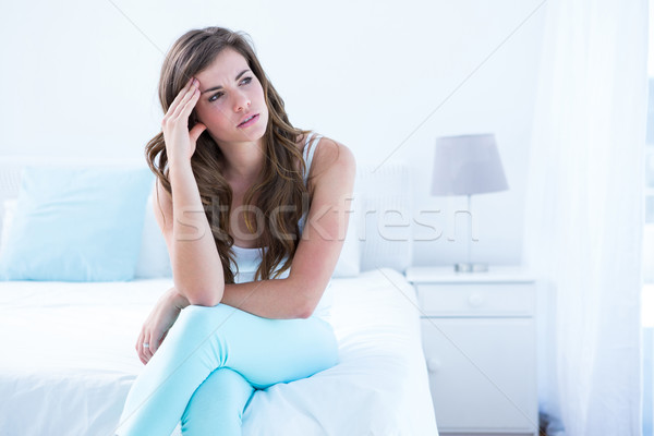 Stock photo: Beautiful woman suffering from headache 