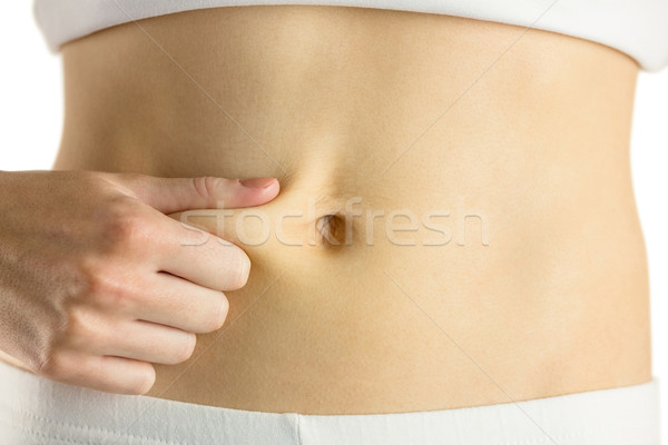Slim woman pinching her belly Stock photo © wavebreak_media