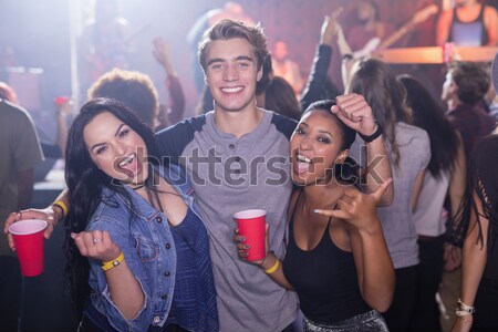 Happy friends taking selfie at music concert Stock photo © wavebreak_media