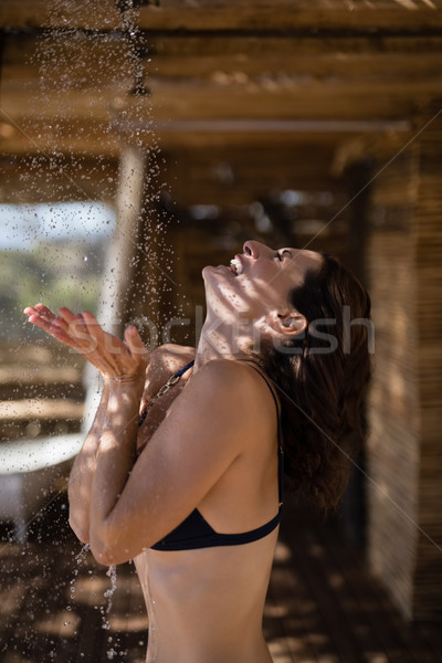 Smiling woman taking bath in shower Stock photo © wavebreak_media