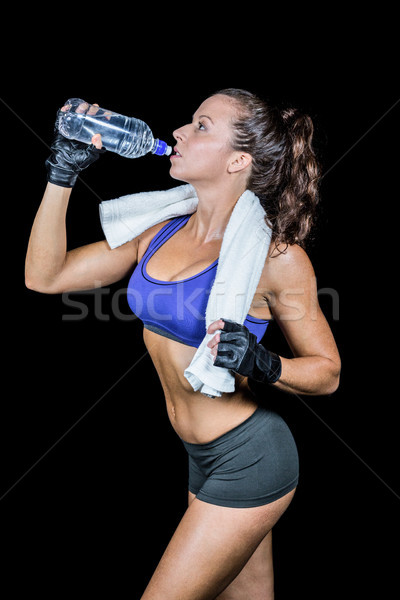 Encajar mujer agua potable negro agua fitness Foto stock © wavebreak_media