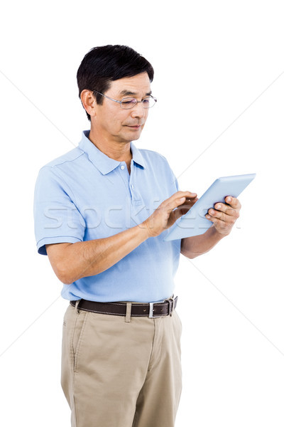 Man using digital tablet while standing Stock photo © wavebreak_media