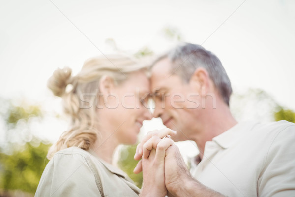 Cute couple danse mains tenant à l'extérieur femme [[stock_photo]] © wavebreak_media