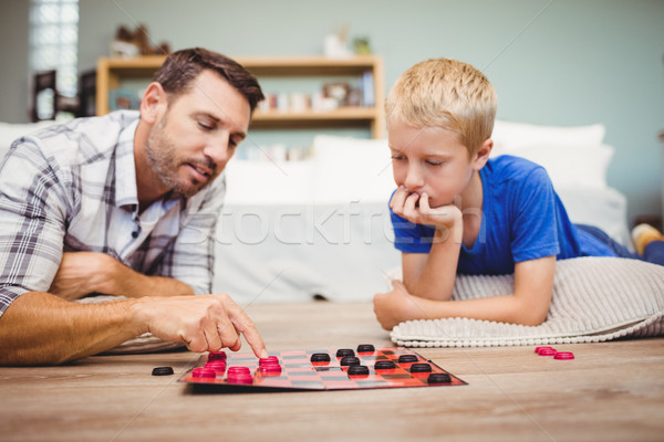 Close-up of father and son playing checker game Stock photo © wavebreak_media