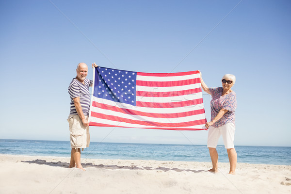 Senior couple holding american flag together Stock photo © wavebreak_media