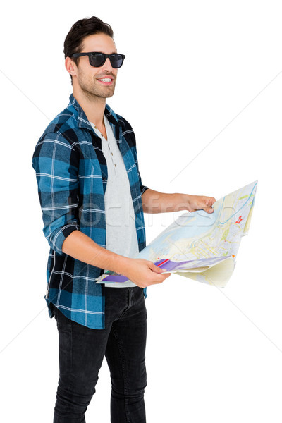 Young man in sunglasses holding map Stock photo © wavebreak_media