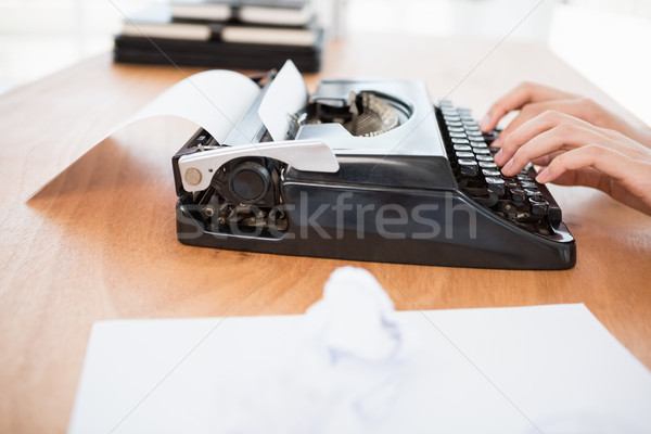 Hipster woman using a typewriter Stock photo © wavebreak_media