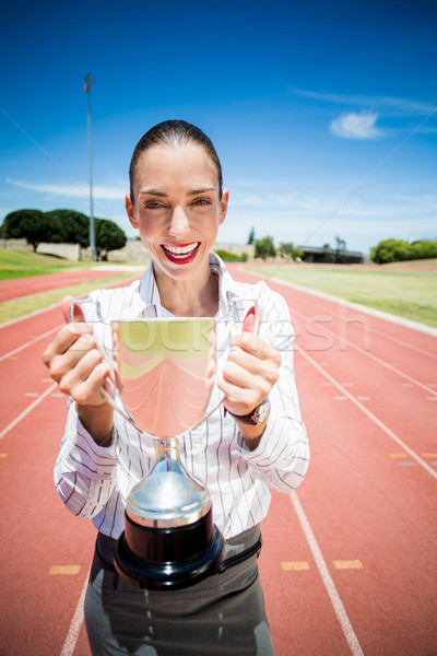 Retrato feliz empresária troféu corrida Foto stock © wavebreak_media