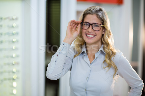 Smiling female customer trying spectacles Stock photo © wavebreak_media