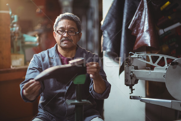 Shoemaker examining a shoe Stock photo © wavebreak_media