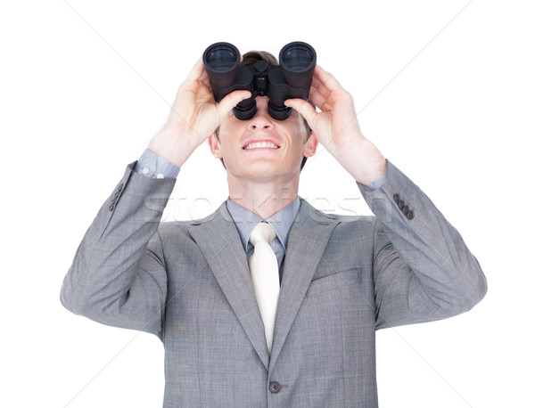Young businessman looking up through binoculars  Stock photo © wavebreak_media