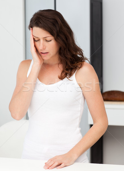 Stock photo: Beautiful woman having a headache in the bathroom