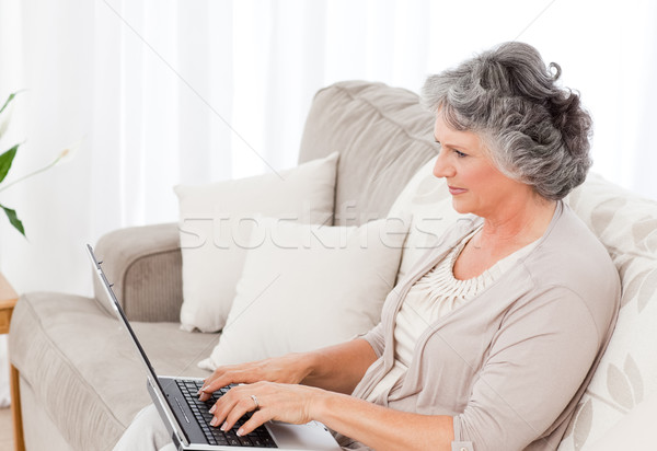 Woman working on her laptop Stock photo © wavebreak_media