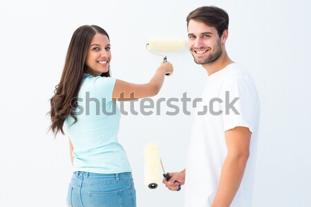 Brunette woman touched by her husband's present against a white background Stock photo © wavebreak_media