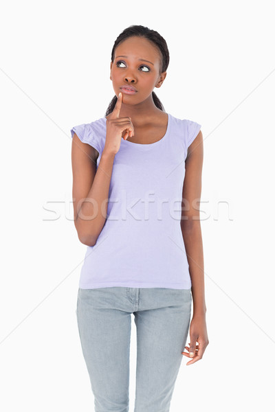 Close up of young woman thinking on white background Stock photo © wavebreak_media