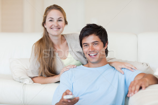 Young couple watching television in their living room Stock photo © wavebreak_media