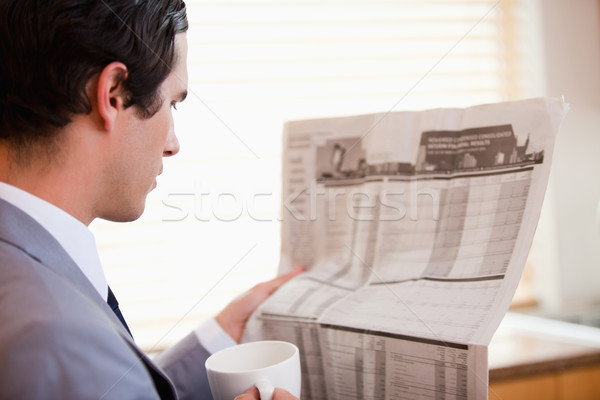 Side view of young businessman reading newspaper Stock photo © wavebreak_media