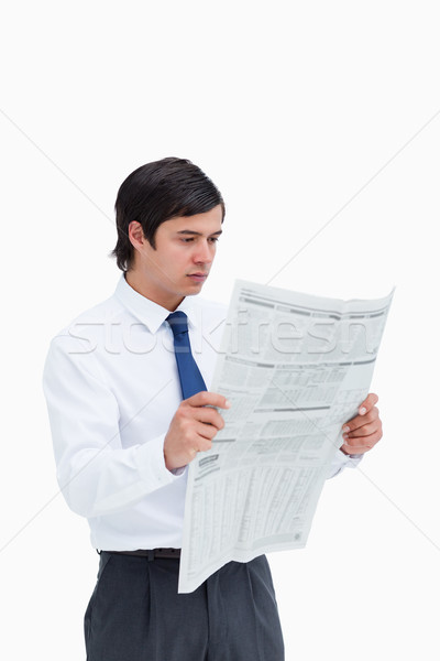 Young tradesman reading the news against a white background Stock photo © wavebreak_media