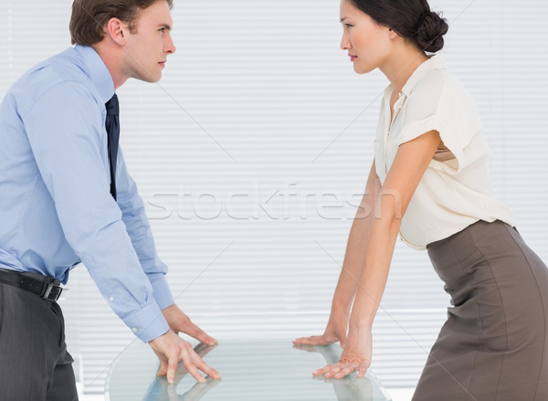 Business couple looking at each other with palms at desk Stock photo © wavebreak_media