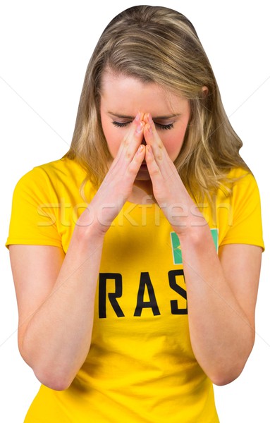 Stock photo: Nervous football fan in brasil tshirt