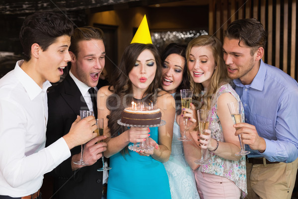 Séduisant amis célébrer anniversaire bar bougie [[stock_photo]] © wavebreak_media