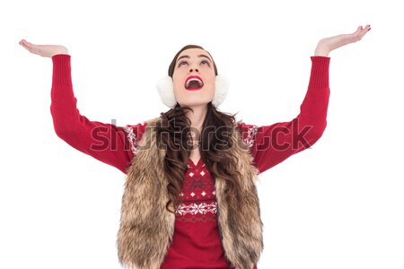 Brunette in winter clothes with hands out Stock photo © wavebreak_media