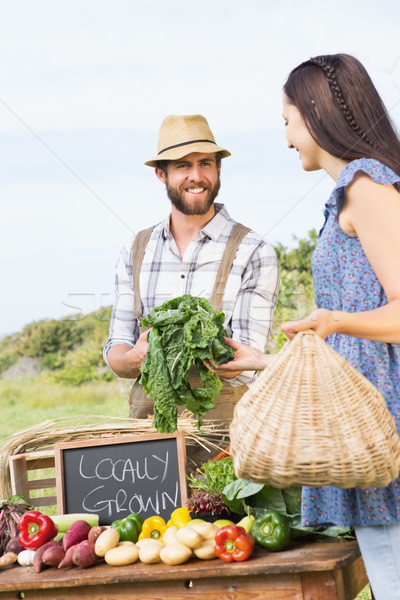 Farmer selling his organic produce Stock photo © wavebreak_media