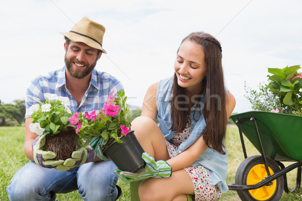 Happy young couple gardening together Stock photo © wavebreak_media