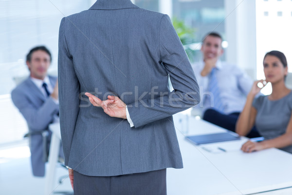 Femme d'affaires doigts derrière Retour bureau femme [[stock_photo]] © wavebreak_media