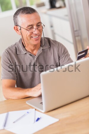 Warehouse manager using telephone and laptop Stock photo © wavebreak_media