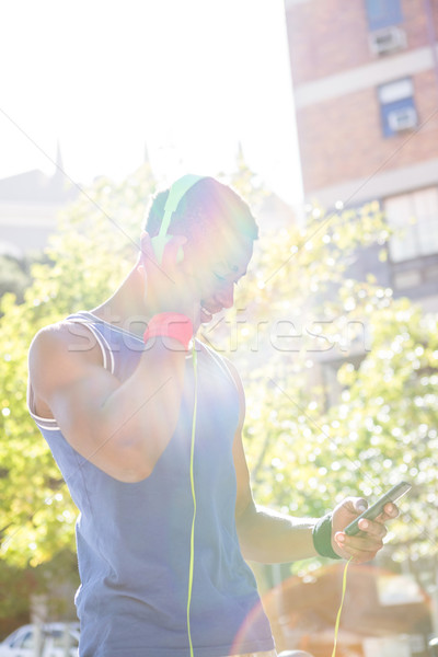 Jóképű atléta telefon napos idő egészség beton Stock fotó © wavebreak_media