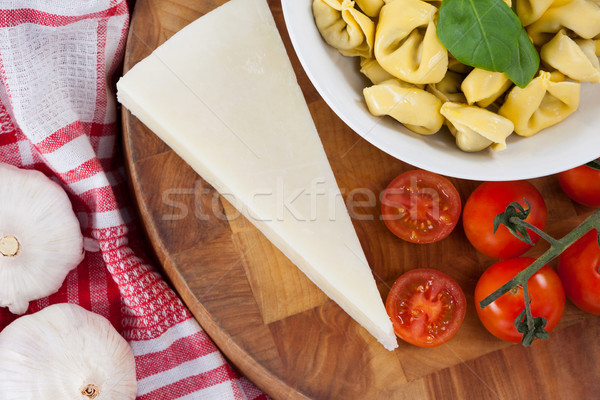 Pasta with cheese, tomatoes, garlic and napkin cloth Stock photo © wavebreak_media
