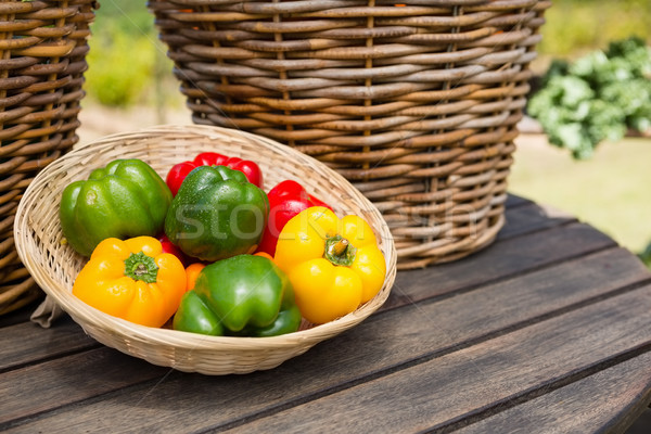 Fresh bell peppers in wicker basket Stock photo © wavebreak_media